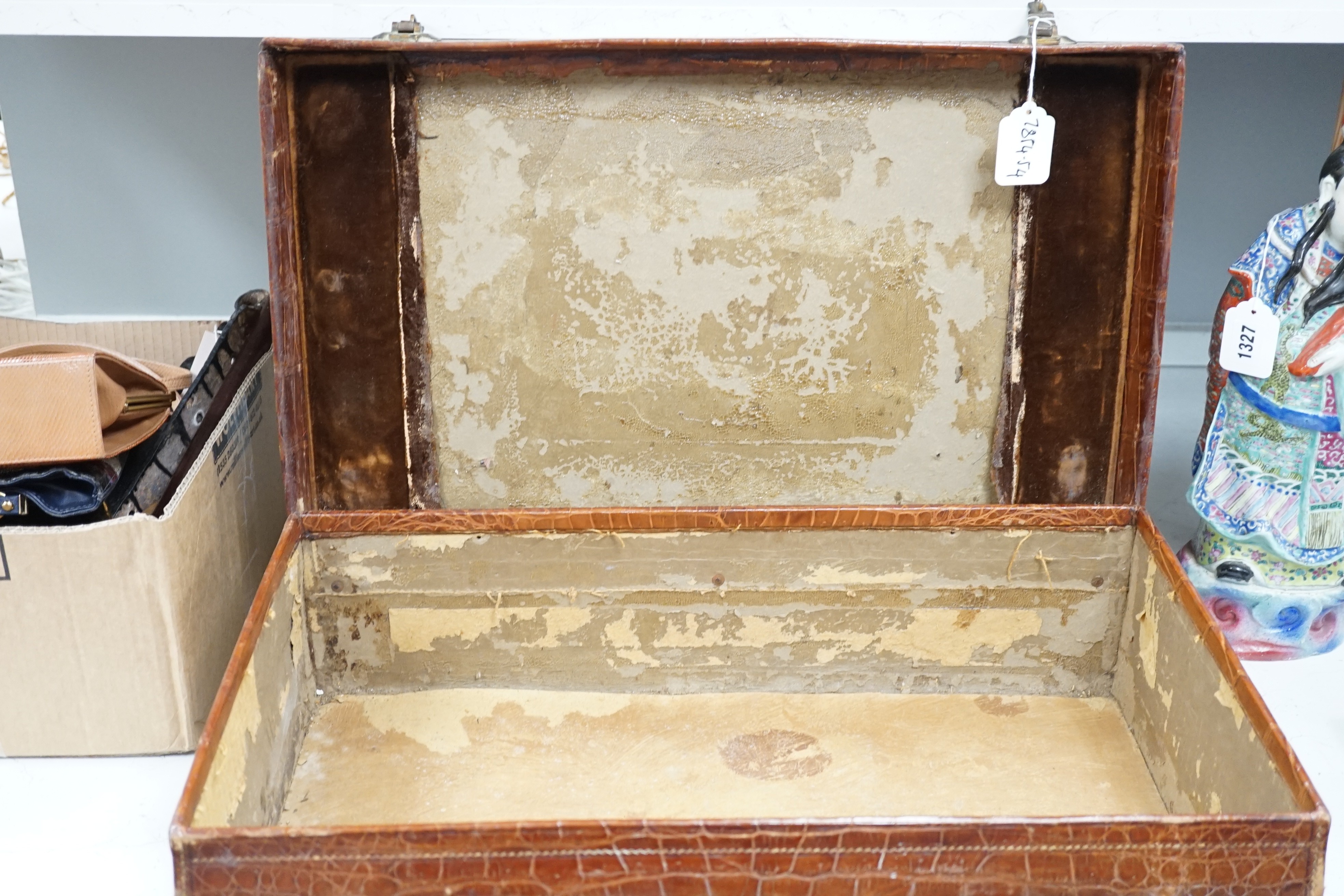 An early 20th century crocodile skin suitcase - 60cm wide